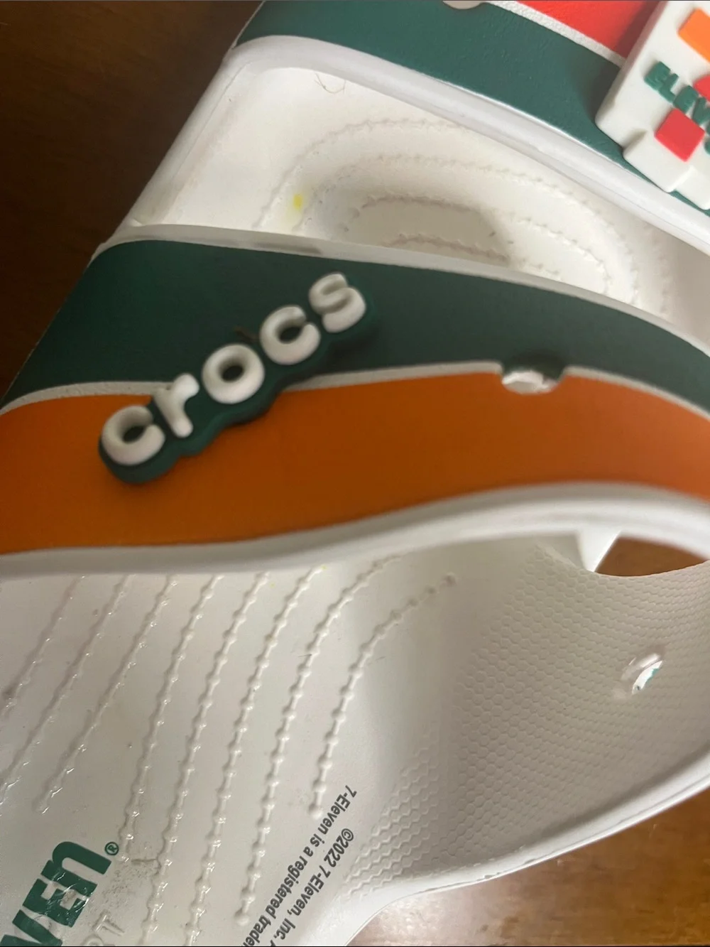 CROCS Kids' White Slides with Orange, Green & Red Stripes
